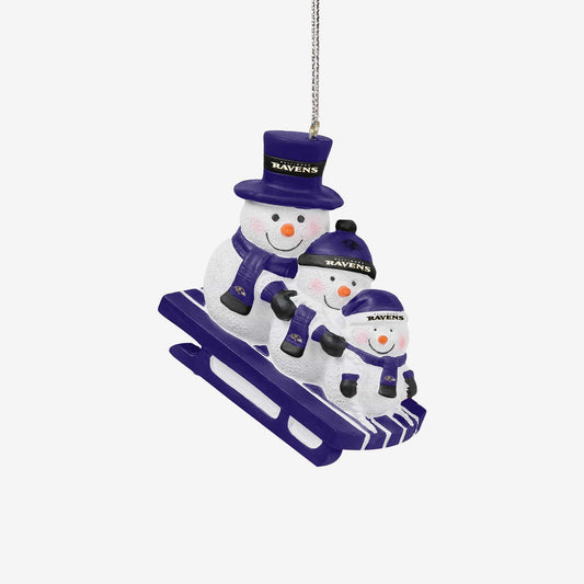 Snowman family with Ravens hats and scarves on a sled ornament