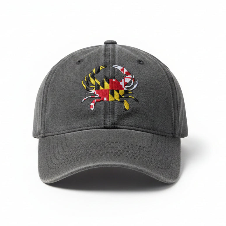 A dark gray baseball cap featuring an embroidered Maryland state flag crab on the front, set against a plain white background.