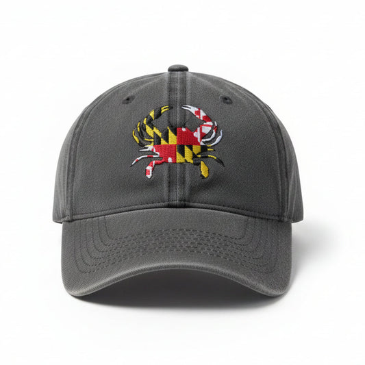 A dark gray baseball cap featuring an embroidered Maryland state flag crab on the front, set against a plain white background.