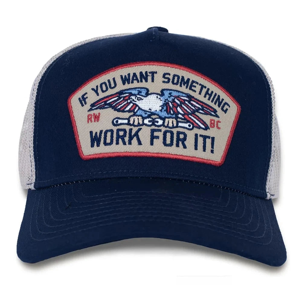 Navy blue cap with a motivational patch on a white background